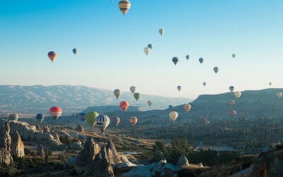 Celebration with hot balloons over landscape in Turkey